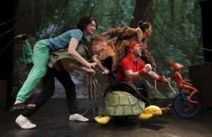 The Race cast and puppets on stage